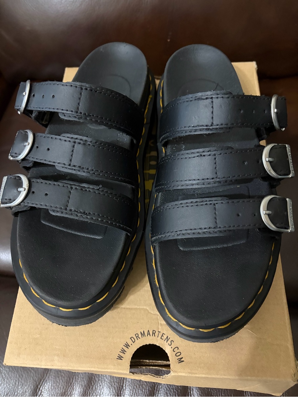 Dr. Martens woman’s Black Triple-Buckle Slide Sandals with Yellow Stitching